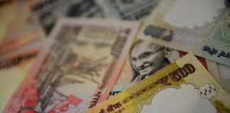 Rupee opens lower at 67.19 against US dollar