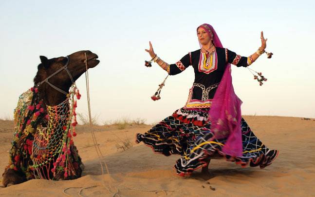 Graceful Dancer performing around the camel.