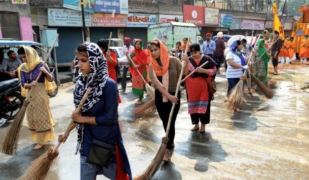 Guru Nanak Jayanti Celebration- Women Sweeping Roads in Varanasi