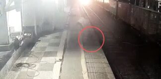 Man throws woman in front of the train